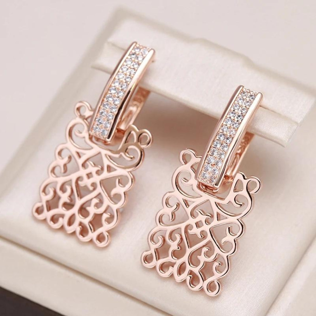 Boucles d'oreilles en or avec zircon rose et lierre