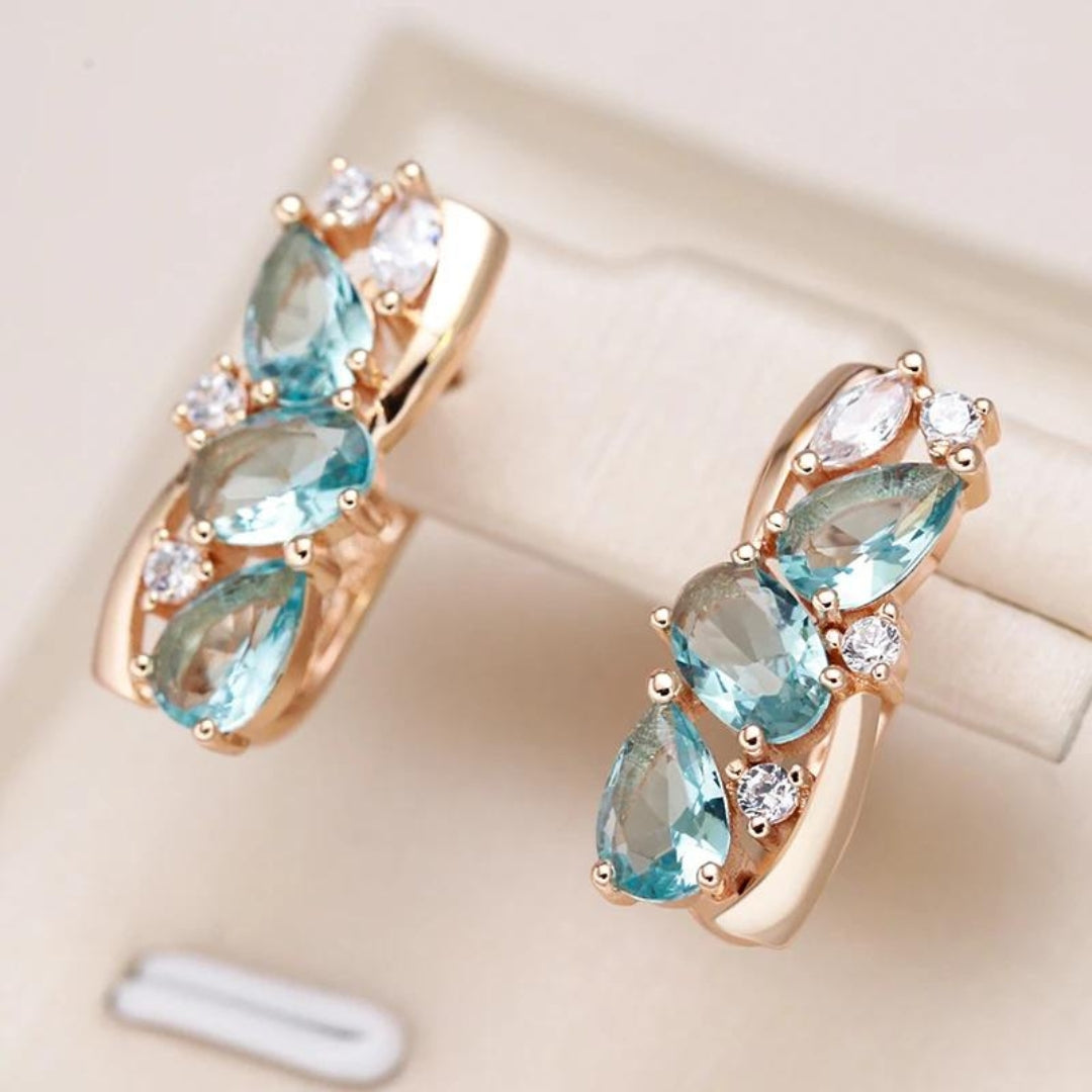 Boucles d'oreilles dorées en zirconium bleu