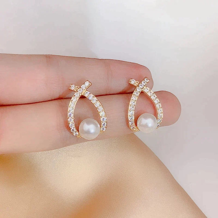 Boucles d'oreilles ornées de perles et de paillettes