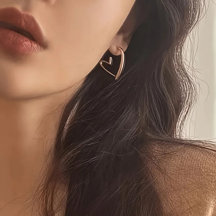 Boucles d'oreilles en or rose élégantes en forme de cœur